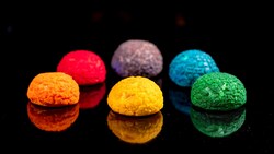 An assortment of 6 Terran Treats, a mini cream puff pastry in the shape of craggy, textured hemispheres