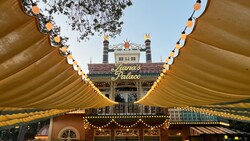 Tiana's Palace restaurant entrance under decorative string lights and canopies