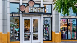 Exterior of Disney Home shop featuring a Mickey Mouse icon sign and merchandise displays at the Downtown Disney District