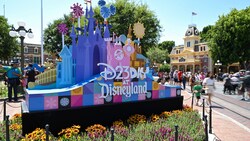The D23 Day at Disneyland Resort decorative sign with castle sculptures