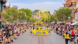 Guests gathered on Main Street, USA to watch a parade featuring the Savannah Bananas and streamers fluttering in the air