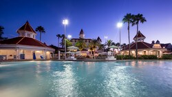 The pool at Bay Lake Tower lit up after dark