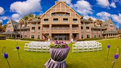 Chairs and flowers set up on the Croquet Lawn behind the main building