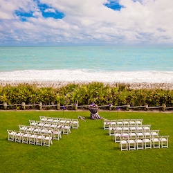 Chairs and flowers set up on the Croquet Lawn overlooking the ocean