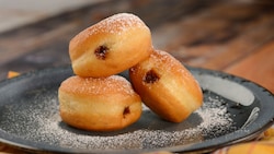3 Italian donuts topped with powdered sugar