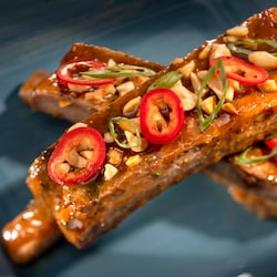 2 glazed ribs topped with peppers, green onions and peanuts