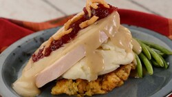 Turkey served with mashed potatoes, stuffing and cranberry sauce