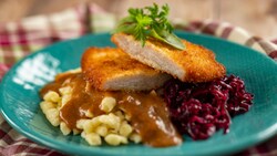 Pork served with mushroom sauce and braised red cabbage