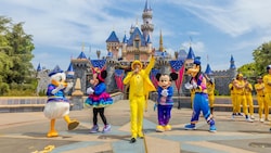 Mickey Mouse and Friends, Jesse Cole, the owner of the Savannah Bananas and Savannah Bananas players in front of Sleeping Beauty Castle at Disneyland Park
