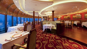 Dining room at Palo restaurant with Italian inspired decor, banquette seating and floor to ceiling windows