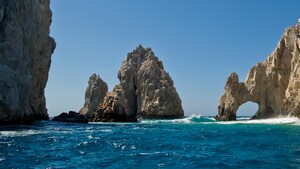 Jagged boulders in the ocean form tiny islands