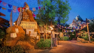 Signs identify Expedition Everest and warn Guests to beware of its perils