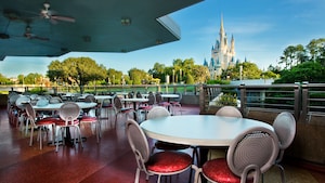 A seating area with a view of Cinderella Castle