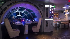 A room with a replica of the cockpit of the Millennium Falcon from Star Wars