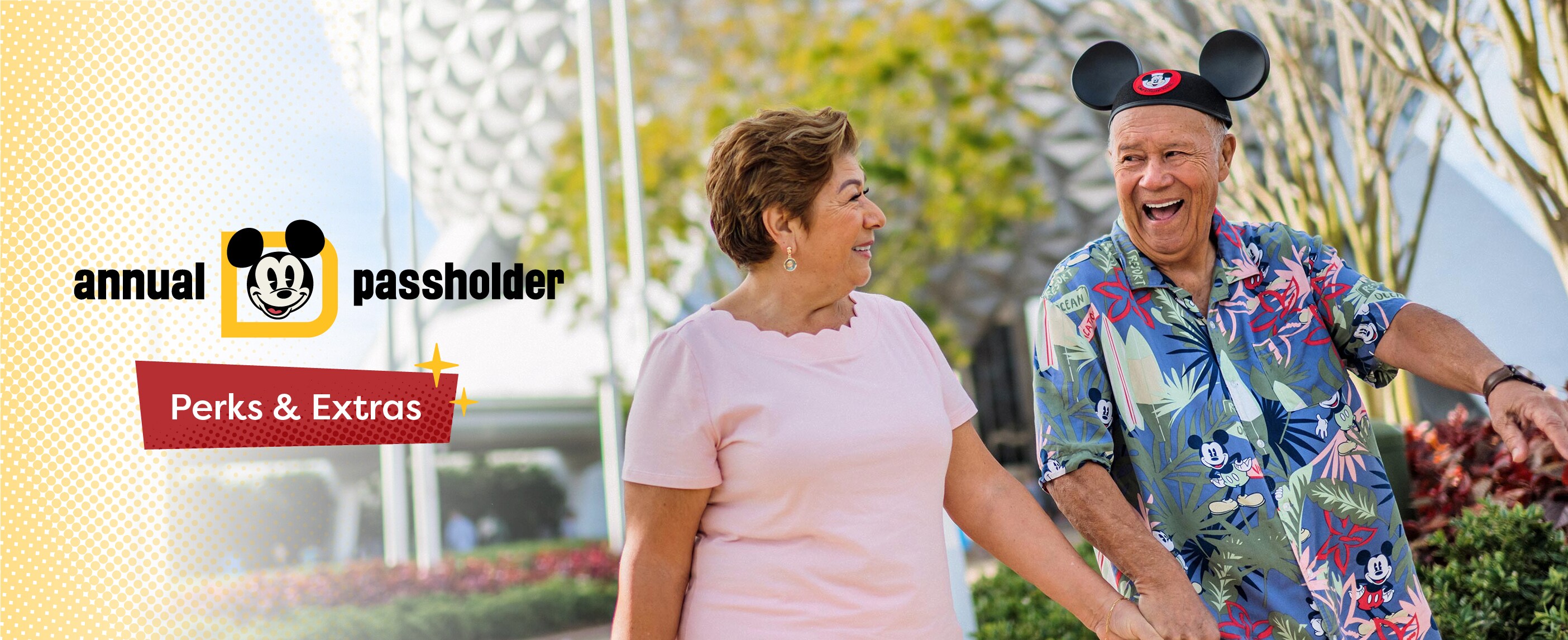 A man wearing a Mickey Mouse ear hat and shirt holding hands with a woman near Spaceship Earth and text that reads ‘Annual Passholder Perks and Extras’