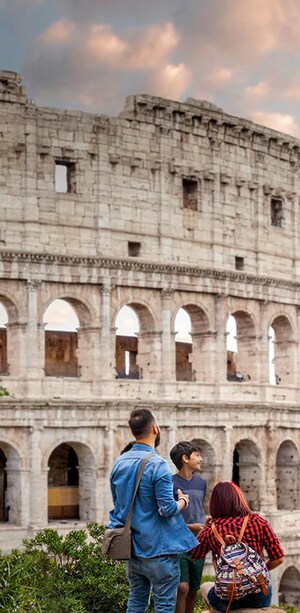 4 Guests admiring the exterior of the Colosseum in Rome, Italy