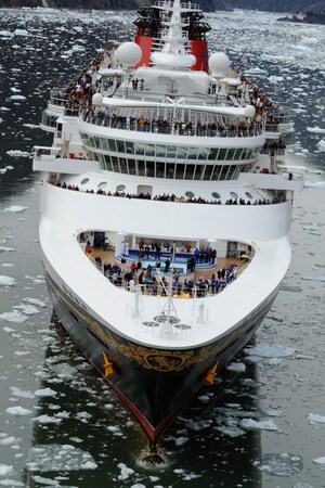 A Disney cruise ship sailing through icy water 