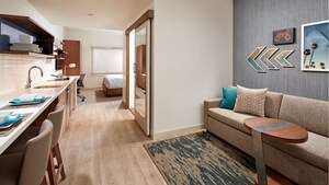 A Kids' Suite with a king bed, dining area, sitting area and desk. 