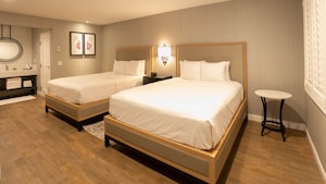 A Deluxe Room featuring 2 queen beds in the Candy Cane Inn