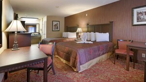 Two queen sized beds in a Standard Room at Castle Inn & Suites
