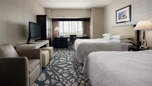 A hotel room with 2 queen sized beds