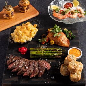 An assortment of food including steak, hamburgers, seafood and sides at S T K Orlando