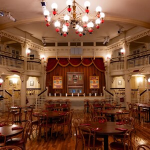 Sit down to a delicious meal in a restaurant inspired by an Old West music hall.