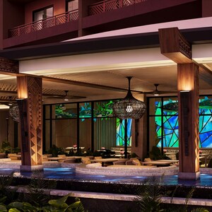 Área de estar ao ar livre ao lado de um recurso aquático na Island Tower of Disney’s Polynesian Villas and Bungalows