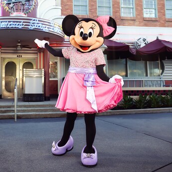 Minnie Mouse strikes a pose in front of Hollywood and Vine wearing party attire