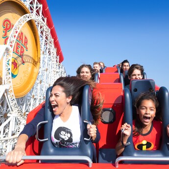 Excited Guests ride Incredicoaster
