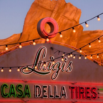A neon sign identifies Luigi's Casa Della Tires