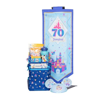 A Disneyland Resort 70th Celebration welcome basket, Mickey Mouse ear hat and banner featuring Sleeping Beauty Castle