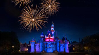 Fireworks go off above Sleeping Beauty Castle at Disneyland Park