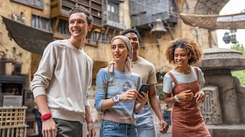 Four Guests walking through Star Wars: Galaxy's Edge