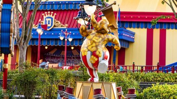 A statue of a Pink Elephant from 'Dumbo', painted like a popcorn bucket