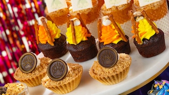 A platter of desserts including brownies, parfaits and crumble cups