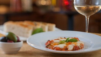  Baked zucchini appetizer topped with pomodoro, mozzarella and parmesan