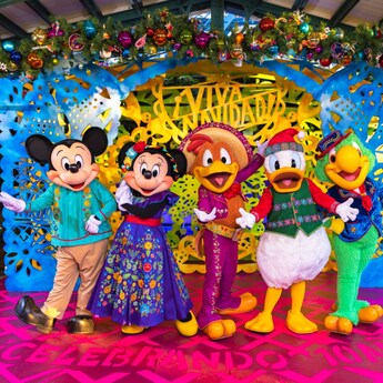 Mickey Mouse, Minnie Mouse and The Three Caballeros wearing Disney Viva Navidad Street Party outfits