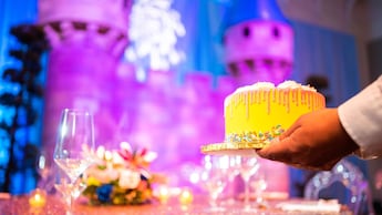 A cake being set on a table