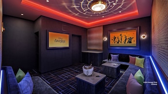 An artist rendering of a private karaoke room with Hercules artwork on the Disney Adventure