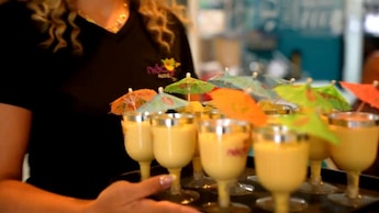 A server carrying a tray of frozen beverages