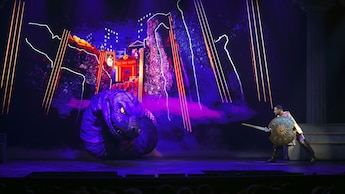 Hercules battling Hydra on stage in a performance of Disney Hercules