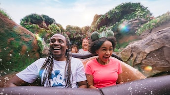 Smiling Guests riding Tiana’s Bayou Adventure at Magic Kingdom park 