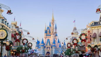 Main Street, U S A decorated for Christmas with Cinderella Castle in the distance