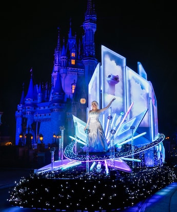 A scene from the Disney Starlight Dream the Night Away nighttime parade at Magic Kingdom park featuring Elsa from Disney’s Frozen 