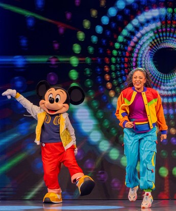 Mickey Mouse, Minnie Mouse and a performer dancing onstage during Disney Junior, Mickey Mouse Clubhouse Live