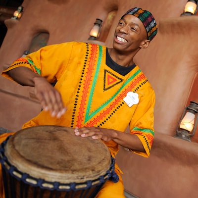 Cast member playing the bongo at Disney's Animal Kingdom Lodge