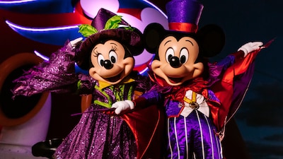 Dressed in Halloween attire, Mickey Mouse and Minnie Mouse perform aboard a Disney cruise