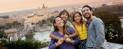 A family biking beside the Danube River