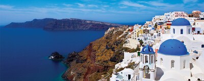 Blue-domed buildings on the coastline of Santorini, Greece